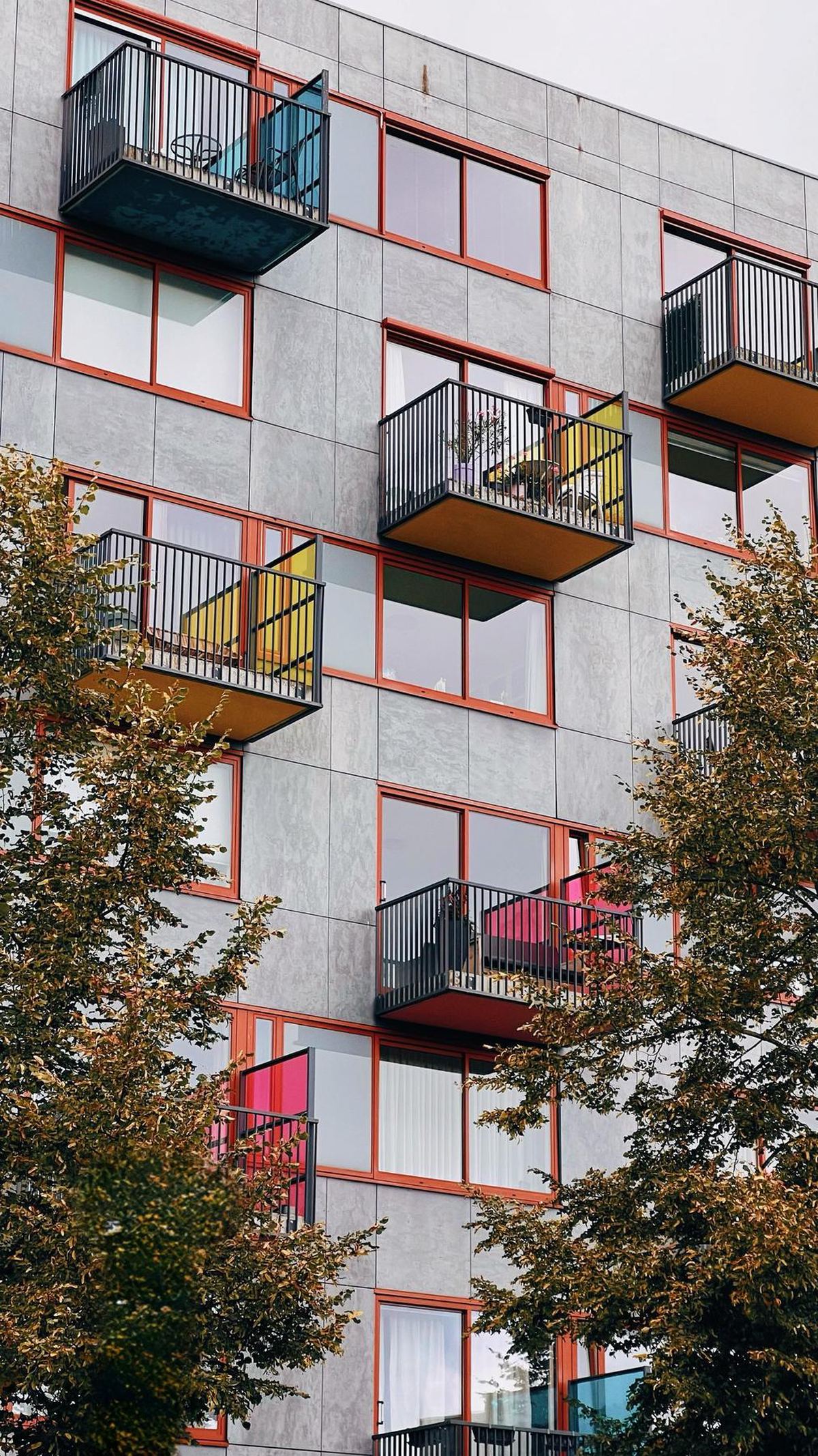 Apartment balconies with colorful panels
